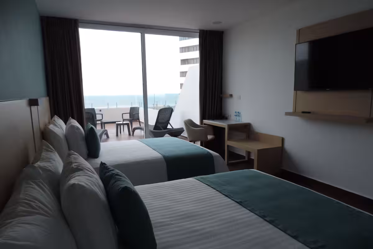 Habitación vista al mar 2 camas queen 3 personas